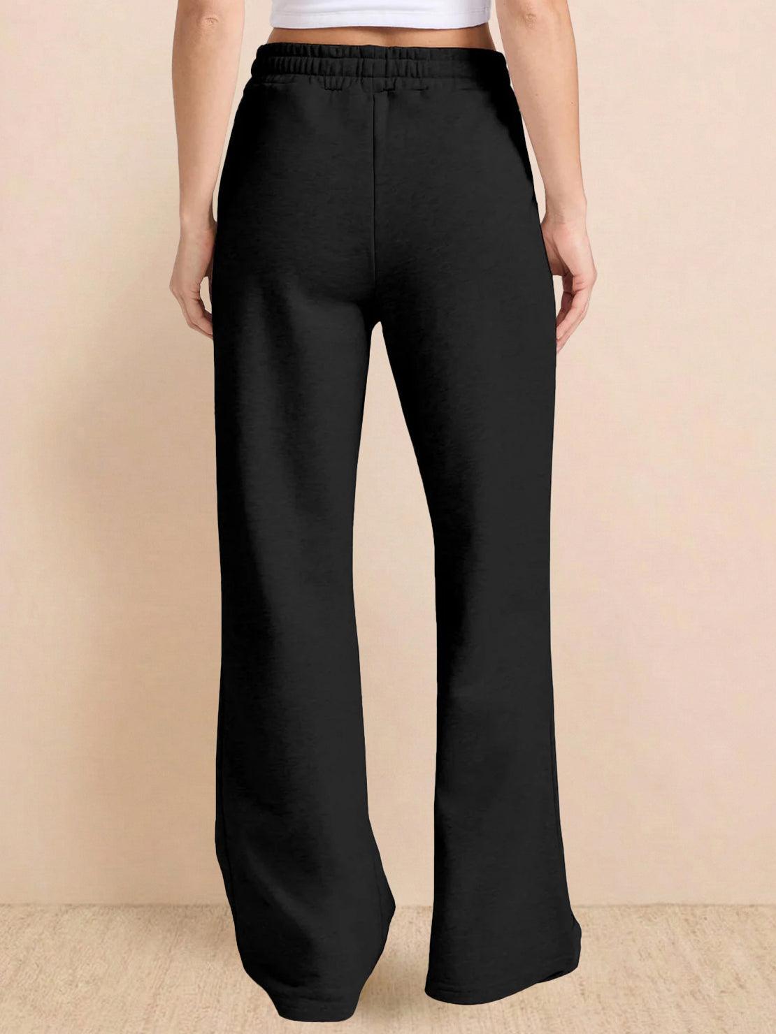 Wrinkle-free polo set with quarter-button top and high-waisted pants in breathable fabric