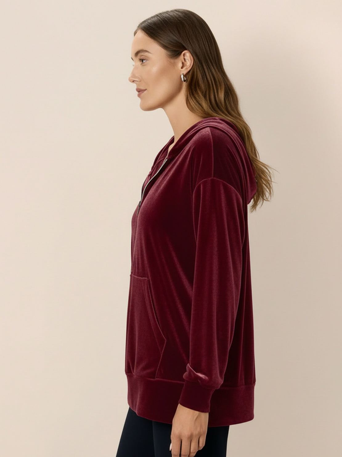 Ultra-soft velvet half-zip hoodie with plush texture and relaxed fit