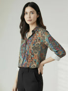 Floral button-down shirt with long roll-up sleeves and relaxed hip-length fit