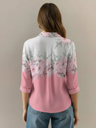 Hip-length floral button-down shirt with long roll-up sleeves and relaxed fit for comfortable casual and work wear