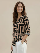 Floral button-down shirt with long roll-up sleeves and hip-length relaxed fit