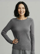 100% pure cashmere round neck pullover with hip-length cut and long sleeves