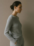 100% pure cashmere round neck pullover with long sleeves and hip-length cut in neutral tone