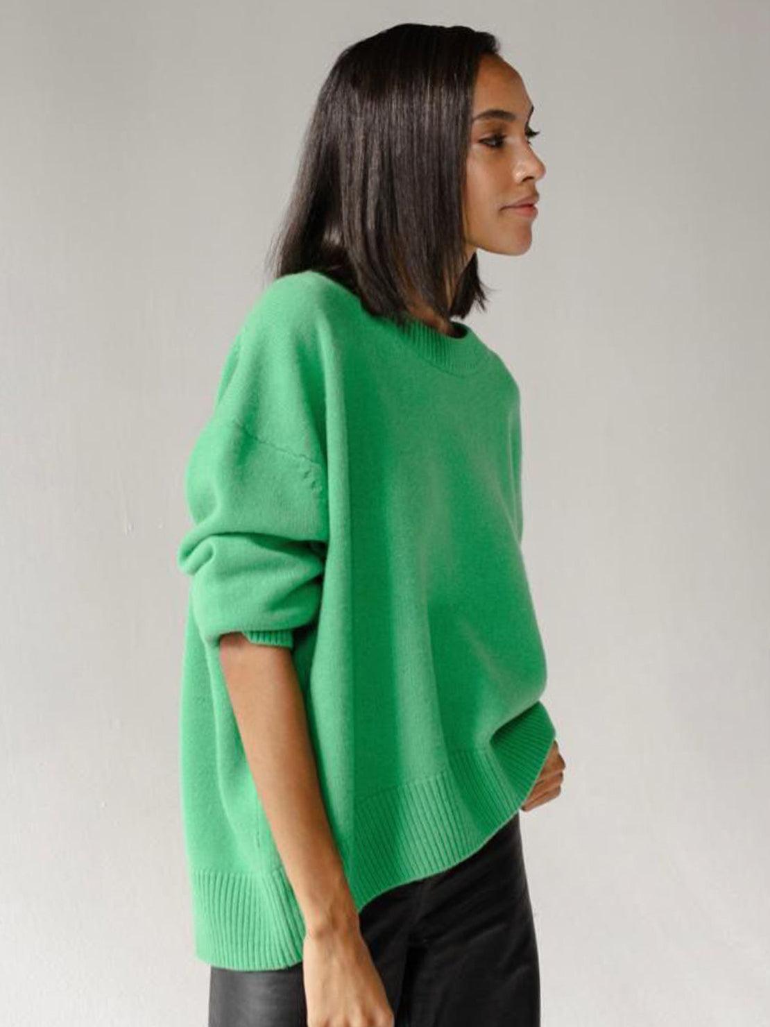 Oversized crew neck knit sweater with drop-shoulder sleeves and ribbed cuffs in neutral color