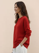 Oversized crew neck knit sweater with drop-shoulder sleeves and ribbed cuffs in neutral color