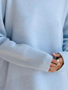 Oversized crew neck knit sweater with dropped shoulders and ribbed cuffs in neutral color