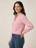 Pleated V-neck long-sleeve blouse with diagonal pleated panel and button cuffs