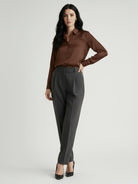 Silk-finish button front shirt with smooth fabric, traditional collar, and relaxed fit