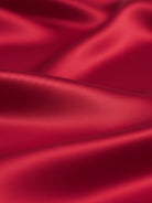 silk-finish button front shirt with relaxed fit and curved hem