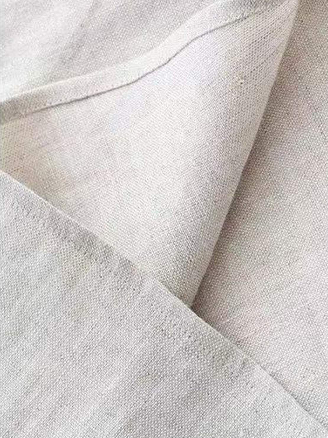 White cotton-linen sleeveless top with round neckline and button back closure