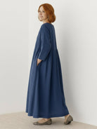 Cotton-linen empire waist dress with natural crinkle texture and deep pockets