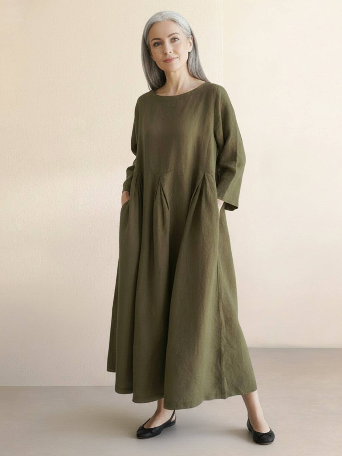 100% cotton-linen empire waist dress with round neckline, 3/4 sleeves, natural crinkle texture, and deep side pockets