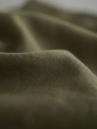 Cotton-linen empire waist dress with natural crinkle texture, maxi length, and side pockets