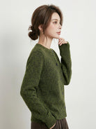 Marled knit merino wool cardigan with button front and ribbed cuffs, displaying natural color variation and relaxed fit