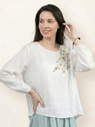 Cotton-linen embroidered blouse with relaxed boxy fit, 3/4 balloon sleeves, and subtle tonal floral embroidery on shoulder