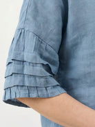 100% cotton two-piece wrap skirt and hip-length top set with crinkle texture and elastic waistband