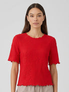 Floral Jacquard Pleated Top with flutter sleeves and 3D floral texture, relaxed A-line fit, and permanent pleating