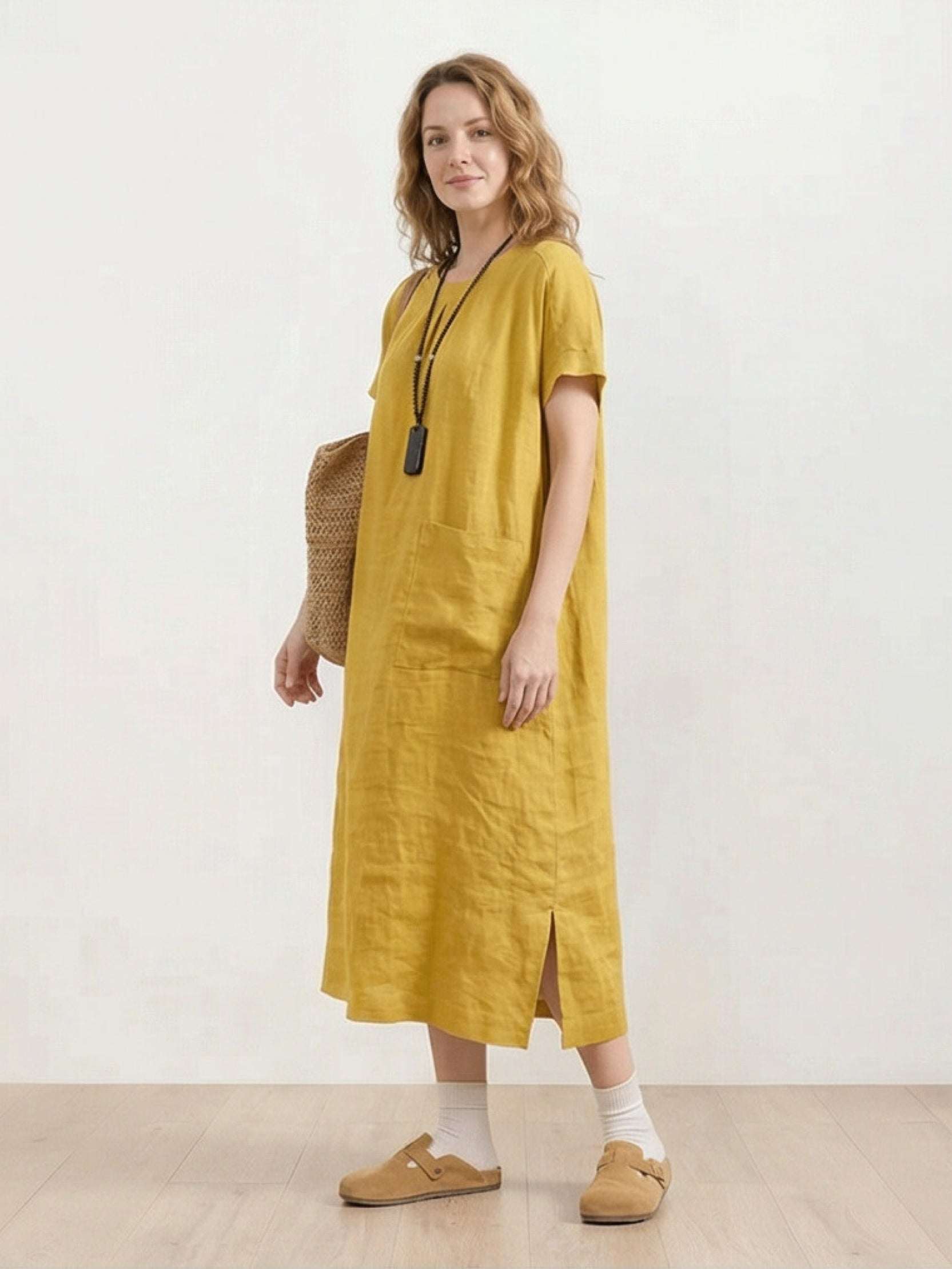 100% linen relaxed midi dress with short sleeves and large front pockets