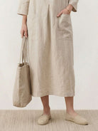 100% linen A-line maxi dress with 3/4 sleeves and front patch pockets