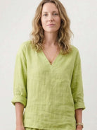 Two-piece cotton linen set with V-neck top and wide-leg pants in breathable fabric