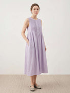 Sleeveless cotton linen pleated midi dress with pintuck bodice and A-line calf-length skirt