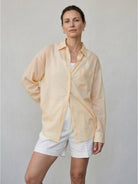 100% linen sheer overshirt with button front and dropped shoulders in lightweight semi-transparent fabric