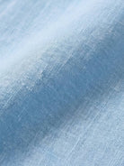 100% linen two-way button blouse with Peter Pan collar and cap sleeves in relaxed A-line fit