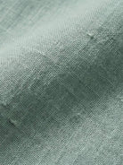 White 100% linen two-way button blouse with Peter Pan collar and cap sleeves