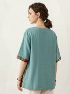 Oversized cotton linen shirt with round neckline and floral patchwork panel