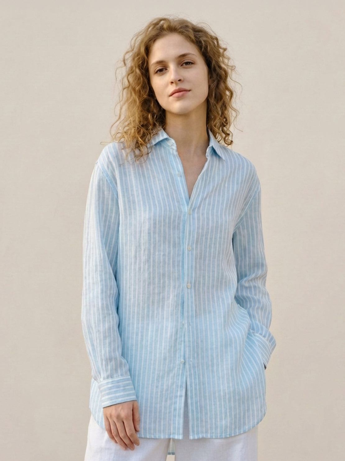 100% linen pinstripe shirt with loose fit, drop shoulders, long sleeves, and curved hem