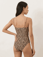 Gold-detail cutout one-piece swimsuit with ruched panels and midi wrap skirt beach set