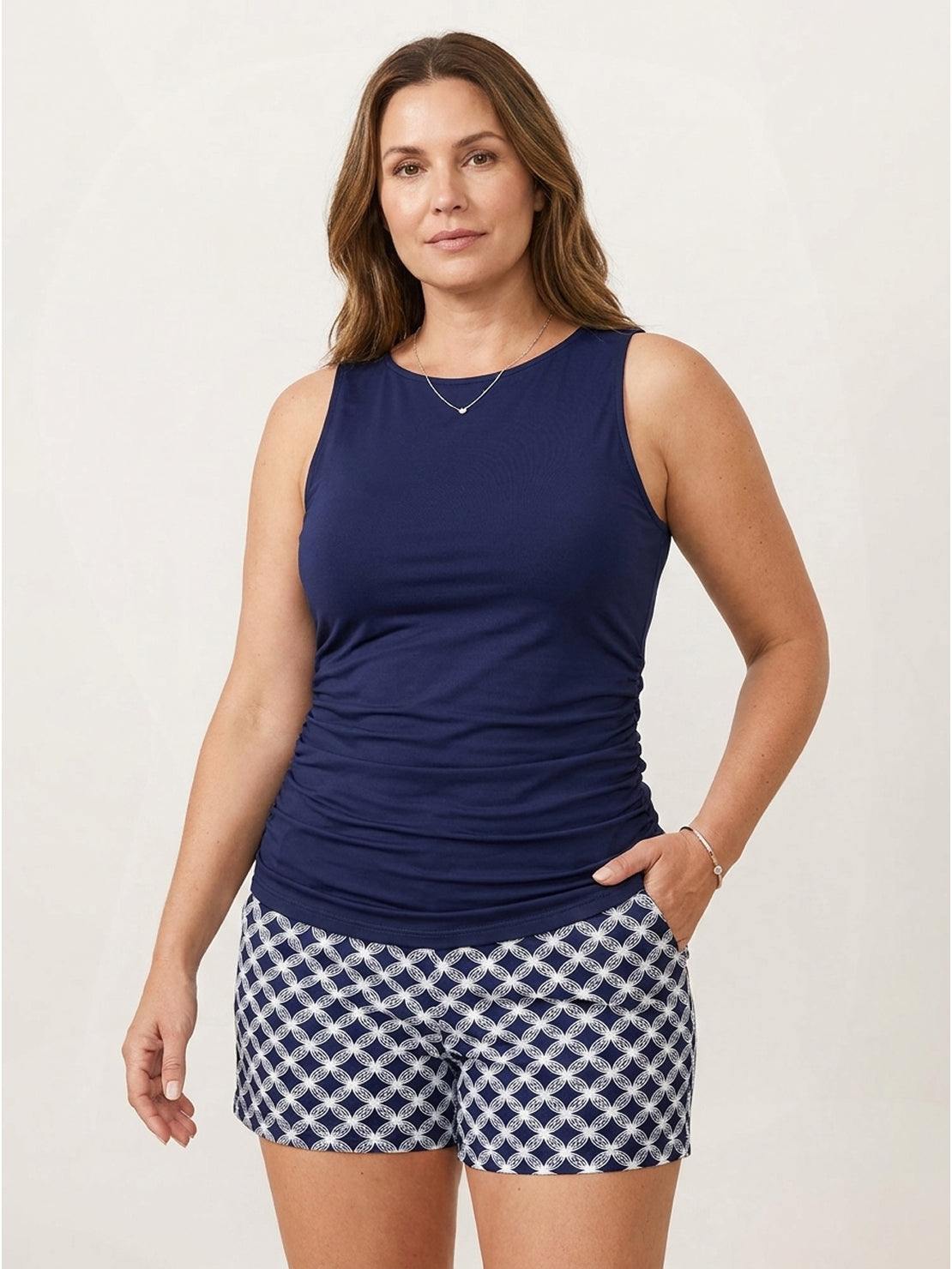 High-neck ruched tankini set with gathered sides and built-in shelf bra, featuring swim skirt or shorts options for beach and poolwear