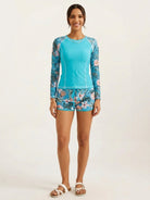 Long-sleeve UV rash guard set with tropical print sleeves and matching swim shorts