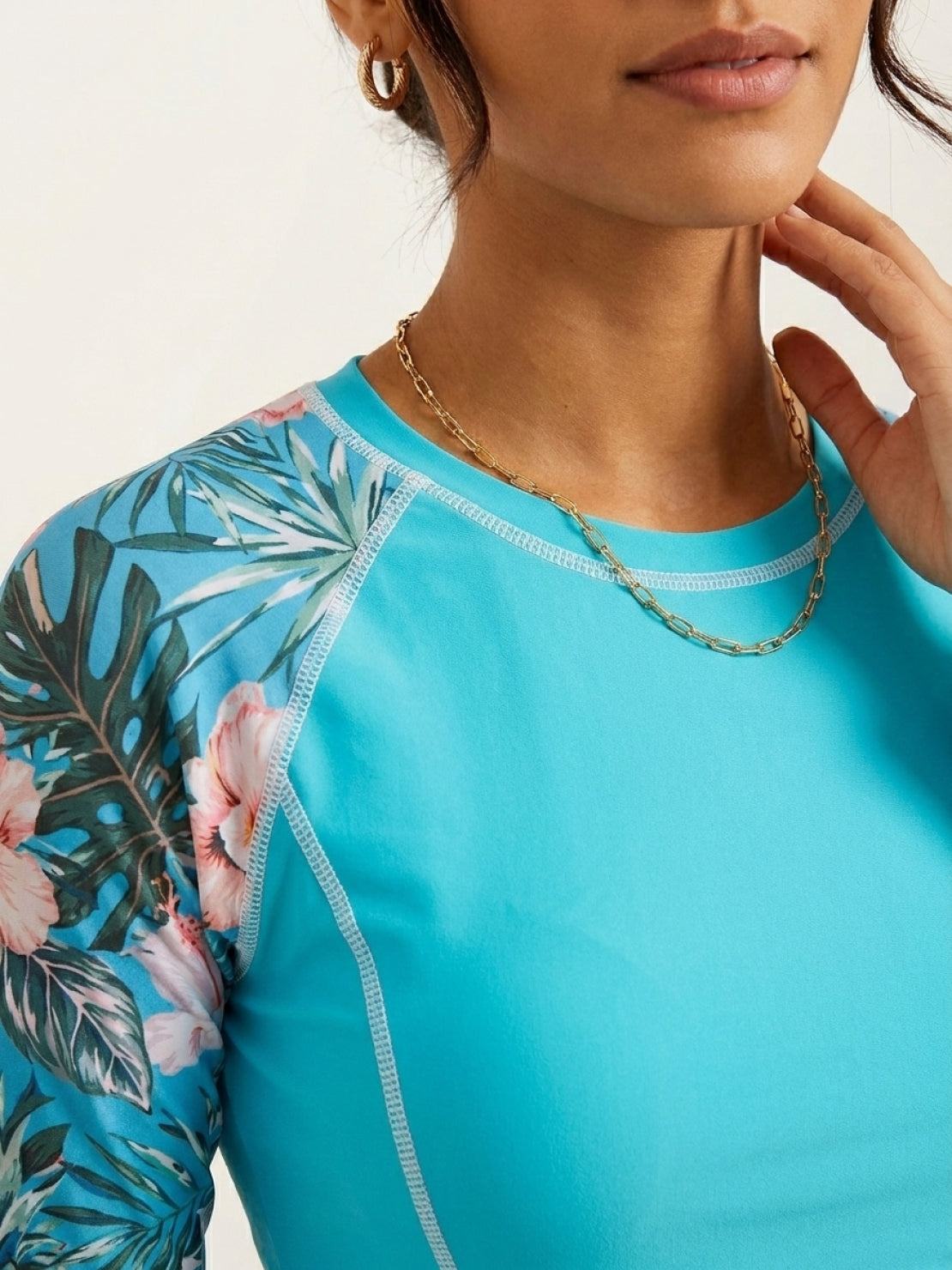 Long-sleeve UV rash guard with tropical print sleeves and matching swim shorts set