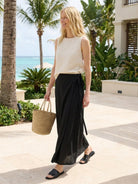 asymmetrical wrap maxi skirt with side tie closure and flowing asymmetric hem in multiple colors