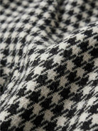 Black and white classic houndstooth commuter blazer with relaxed fit and structured shoulders