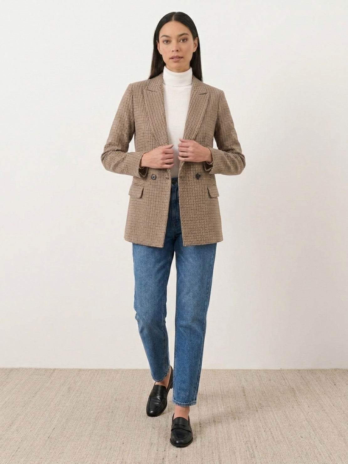 Structured houndstooth commuter blazer with relaxed fit, notched lapel, double-button closure, and front pockets