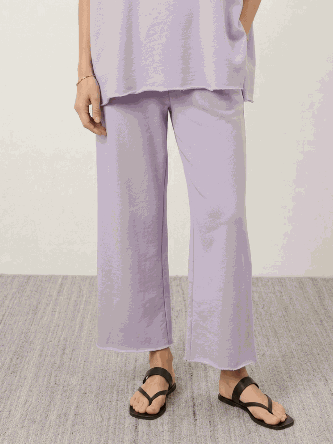 Woman wearing cotton-blend capelet top with wide-leg pants lounge set in blush pink