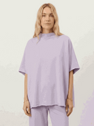 Cotton-blend capelet top with batwing sleeves paired with cropped wide-leg pants in relaxed fit lounge set
