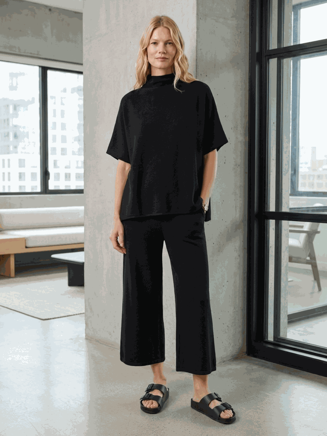 Woman wearing cotton-blend capelet top with batwing sleeves and wide-leg pants lounge set in chocolate brown