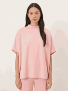 Women wearing cotton-blend capelet top with batwing sleeves and cropped wide-leg pants lounge set