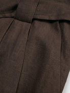white linen belted shorts with relaxed wide-leg fit and high-rise waist