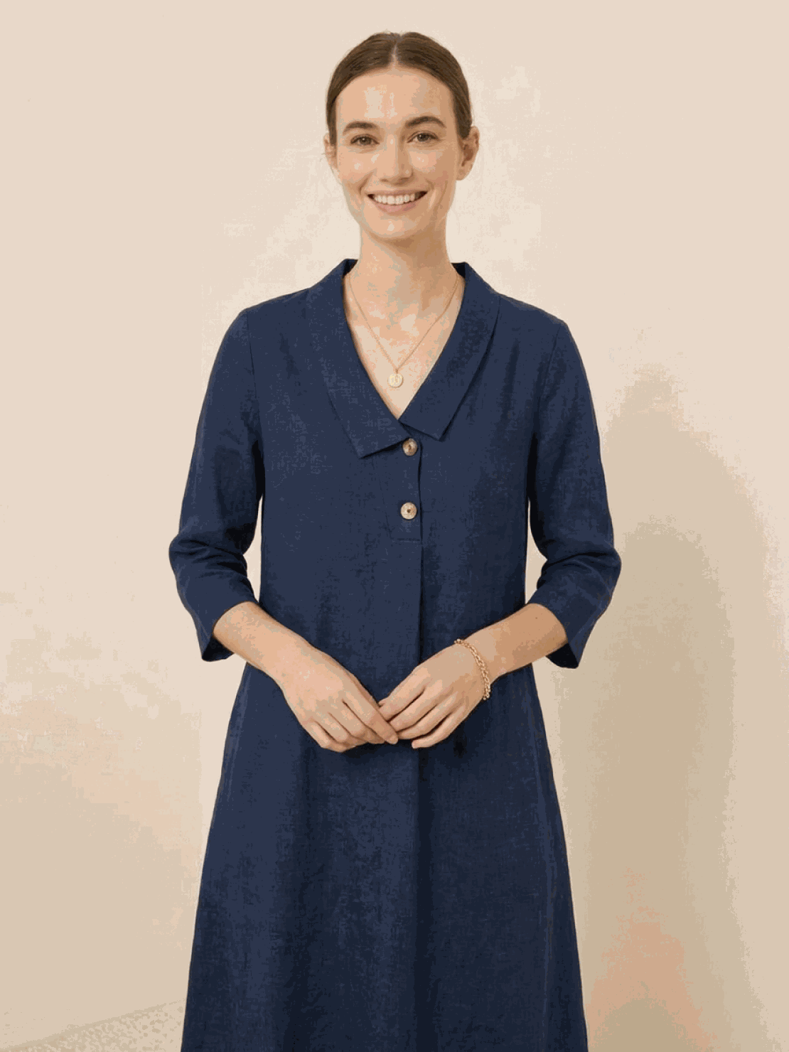 Woman wearing relaxed fit linen-look midi dress with blazer neckline and button detail