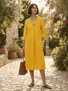 Navy linen-look midi dress with relaxed fit, V-neckline, button detail, and 3/4 sleeves