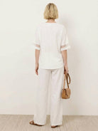 Lightweight linen top with V-neck and button detail for mature women