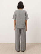 comfortable 100% cotton two-piece set with button-front top and wide-leg pants in soft solid colors
