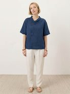 100% linen relaxed V-neck top with asymmetric button detail and short sleeves