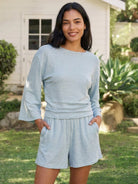 Light blue linen blend lounge set with fitted cropped top and ruched waist, styled for spring and summer comfort