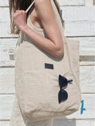 Beige cotton linen canvas shoulder bag with front pocket and comfortable straps for everyday use