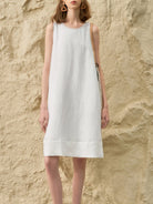 Sleeveless linen lyocell blend shift dress with relaxed A-line silhouette in white and black colors